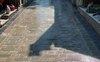 Intricate paver driveway by Roma Paving